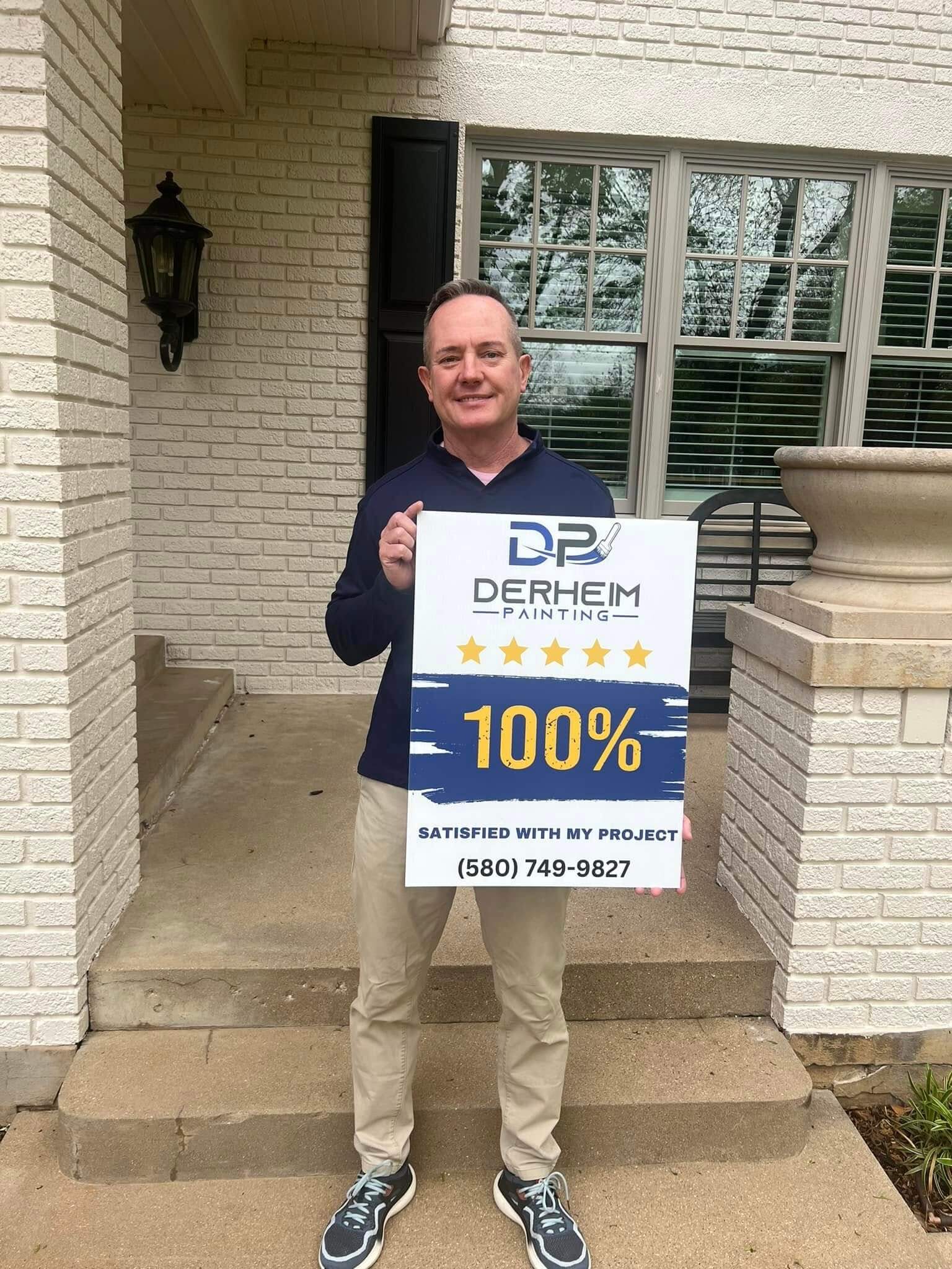 happy customer standing in front of finished project with a 100% satisfied sign
