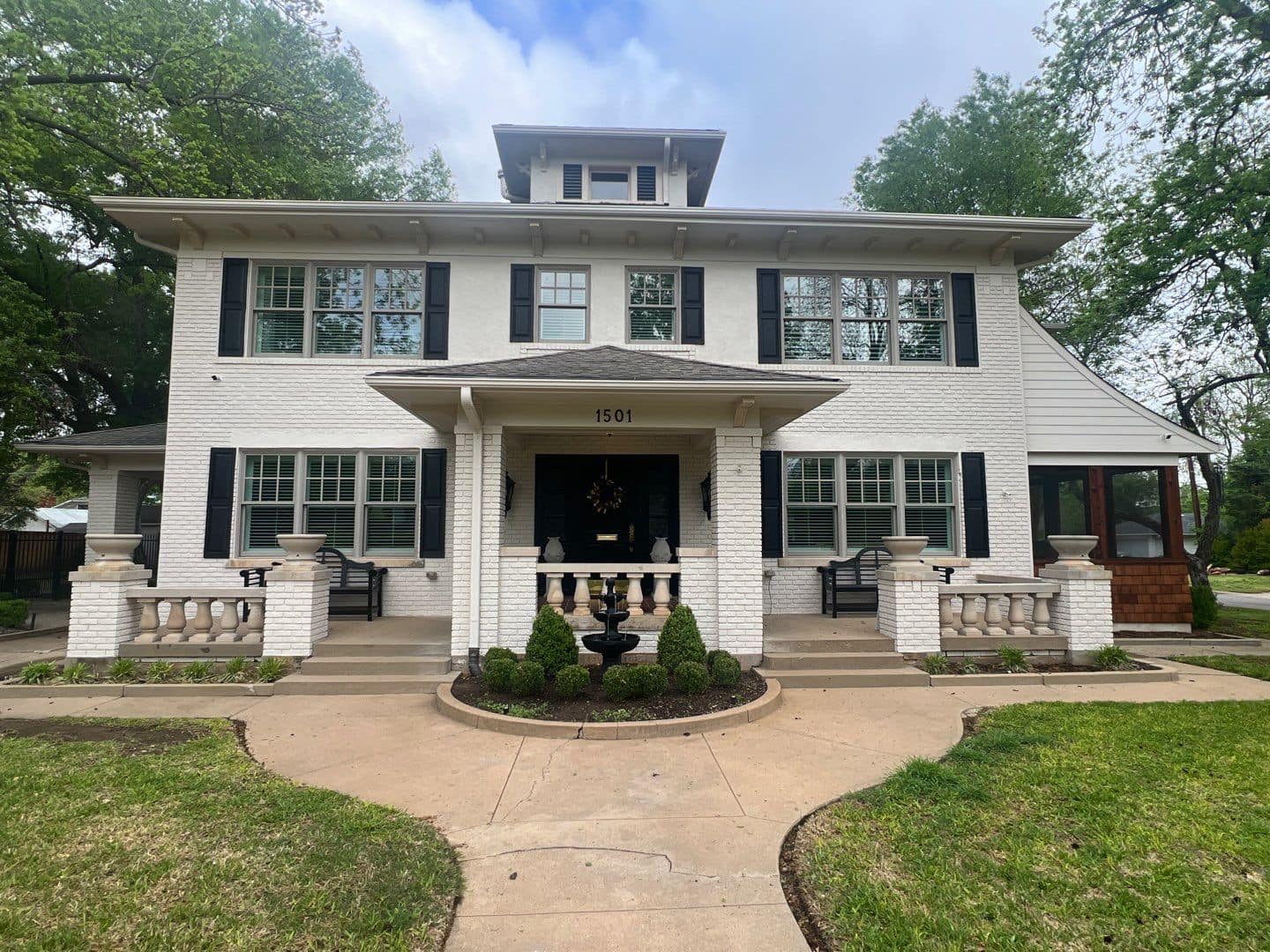 Derheim Painting white brick exterior transformation on a large historic Ardmore home