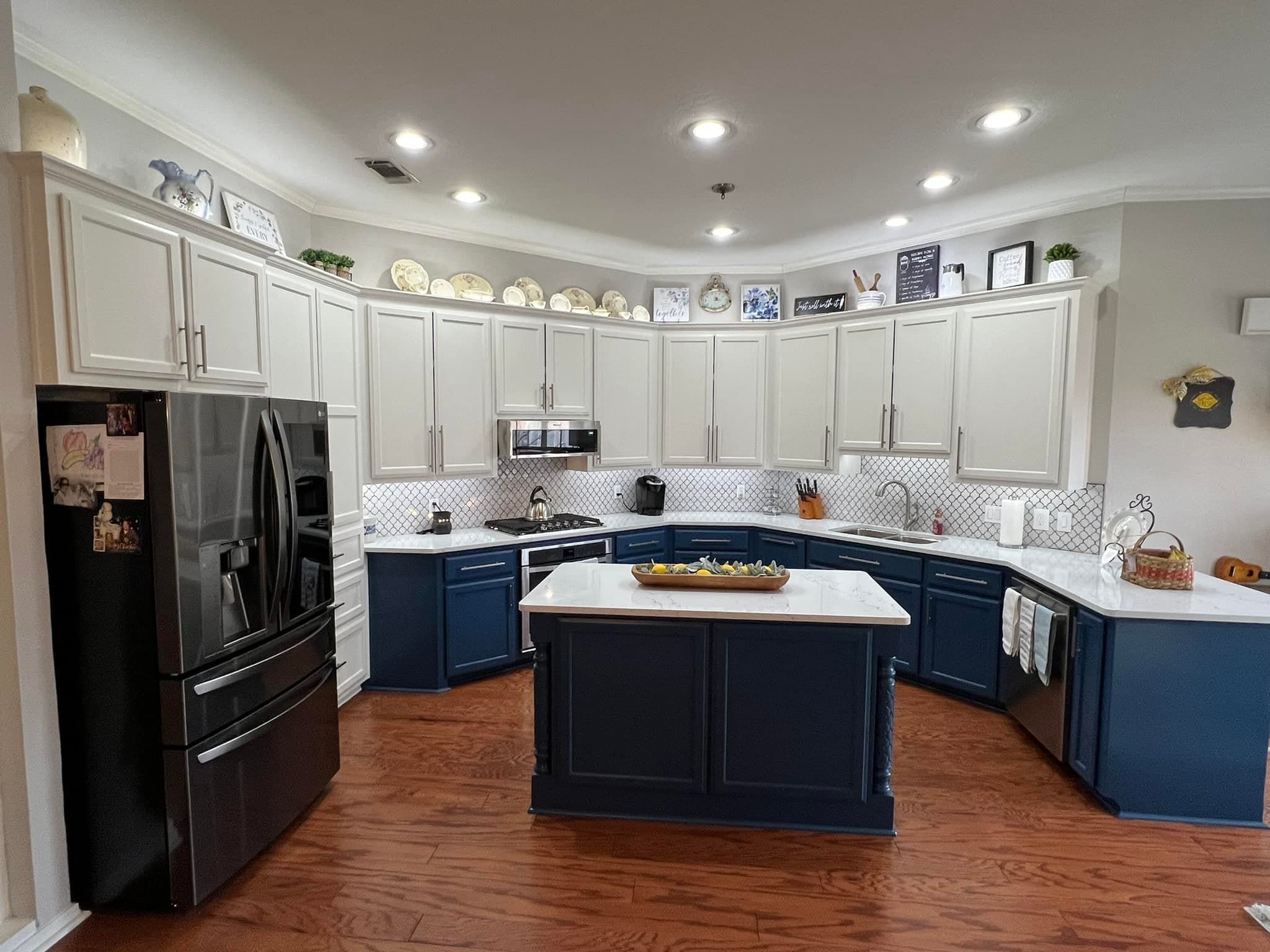 Derheim Painting navy blue and white two-tone cabinet painting project in Ardmore, OK