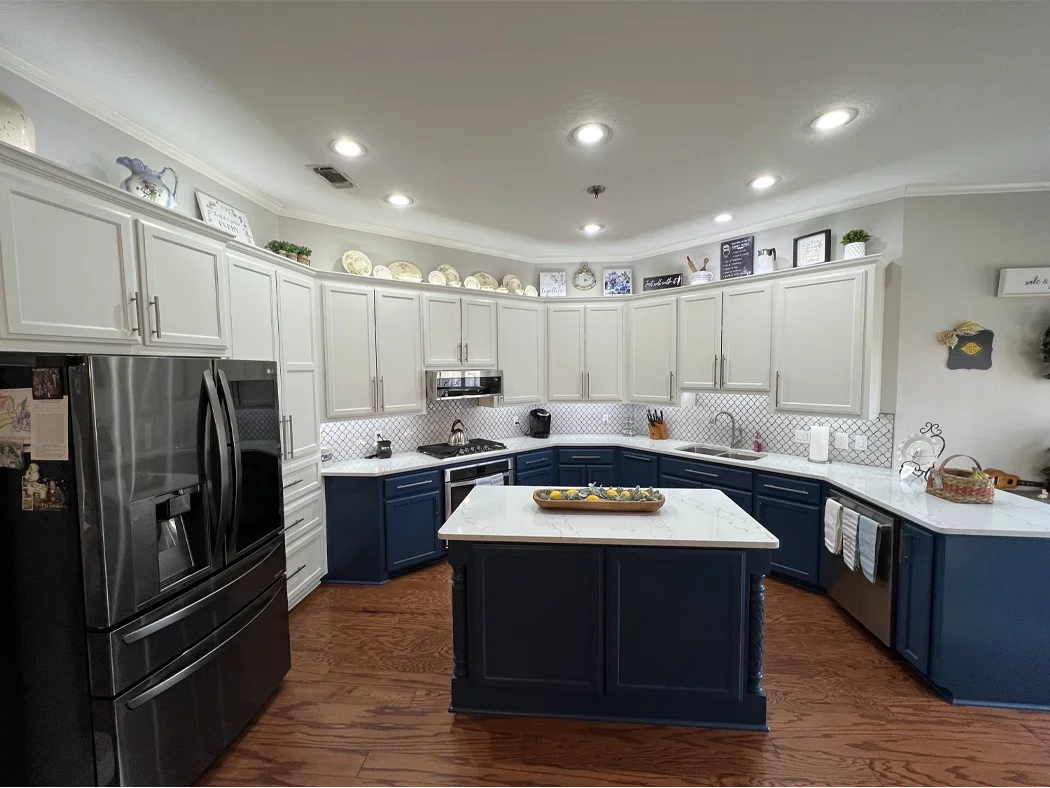 Two-tone navy and white cabinet painting completed by Derheim Painting